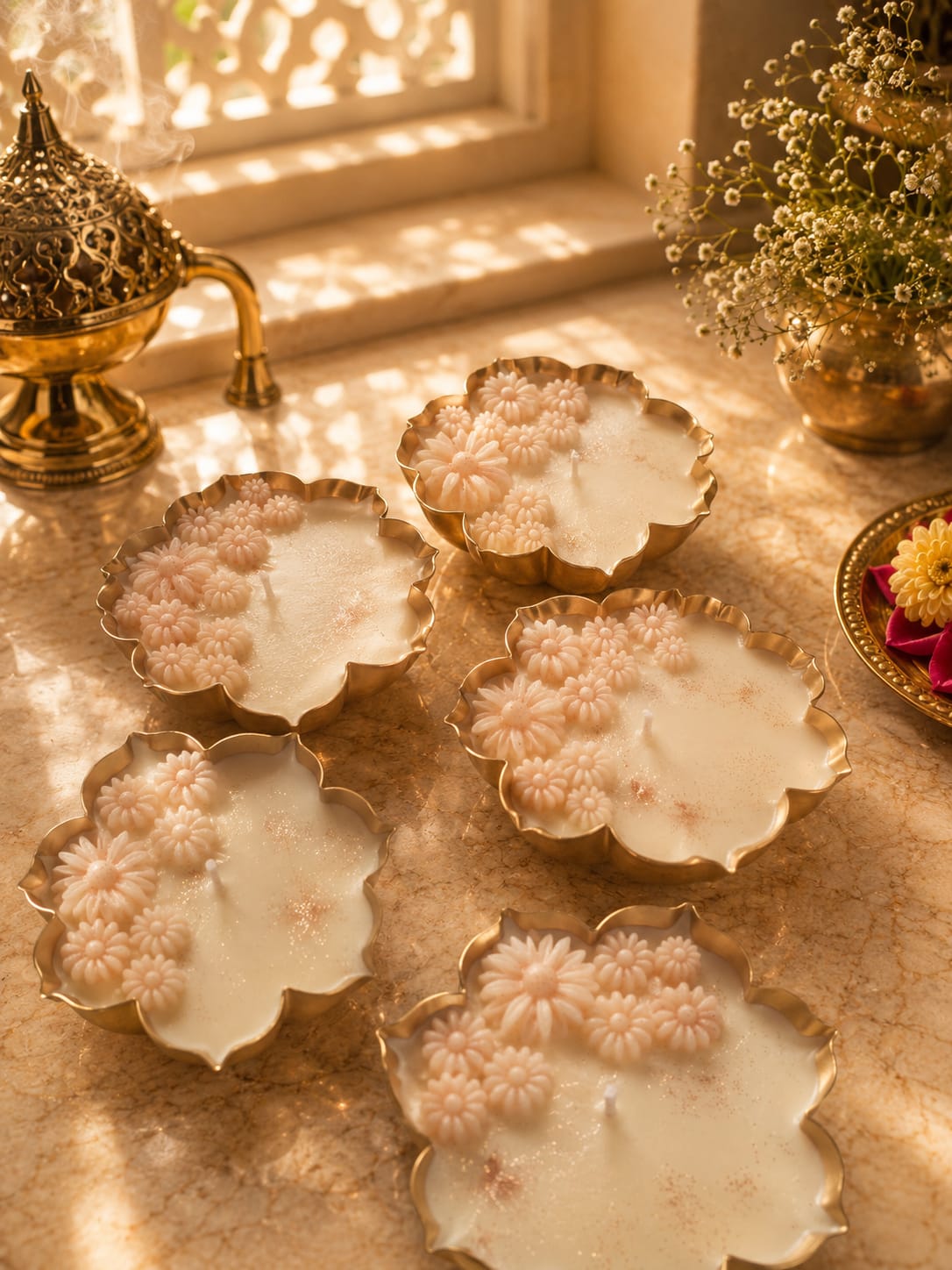 Festive Collection - handcrafted floral wax candles in brass holders with golden light